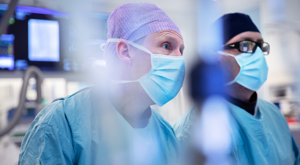 Two male medical professionals during a surgery