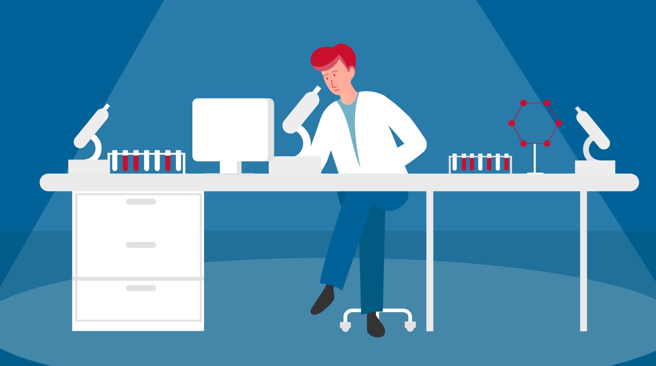 Forskare vid sitt skrivbord