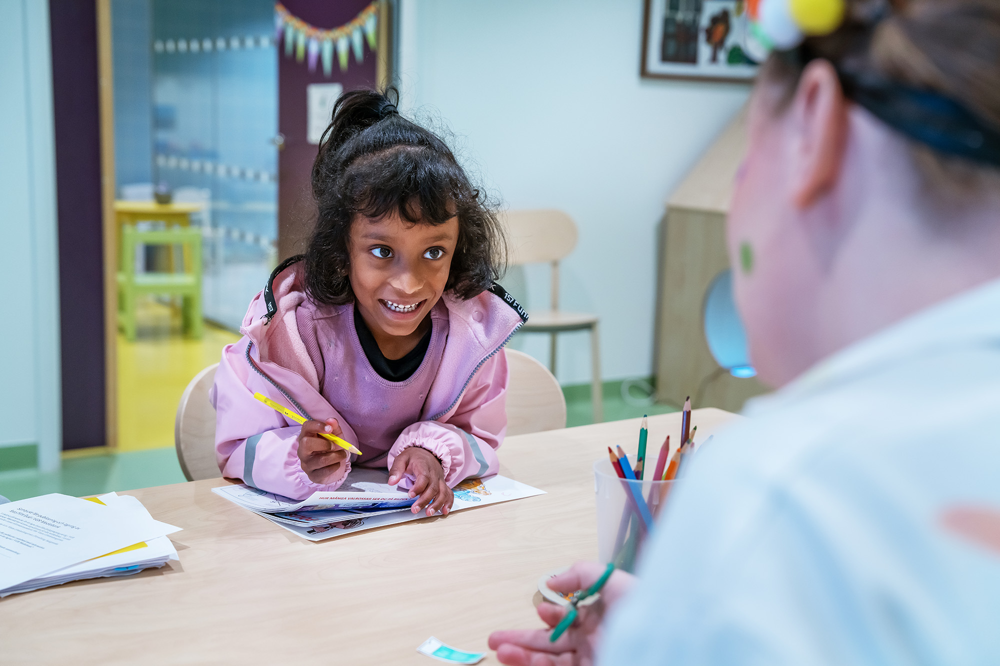 A child with a pencil.