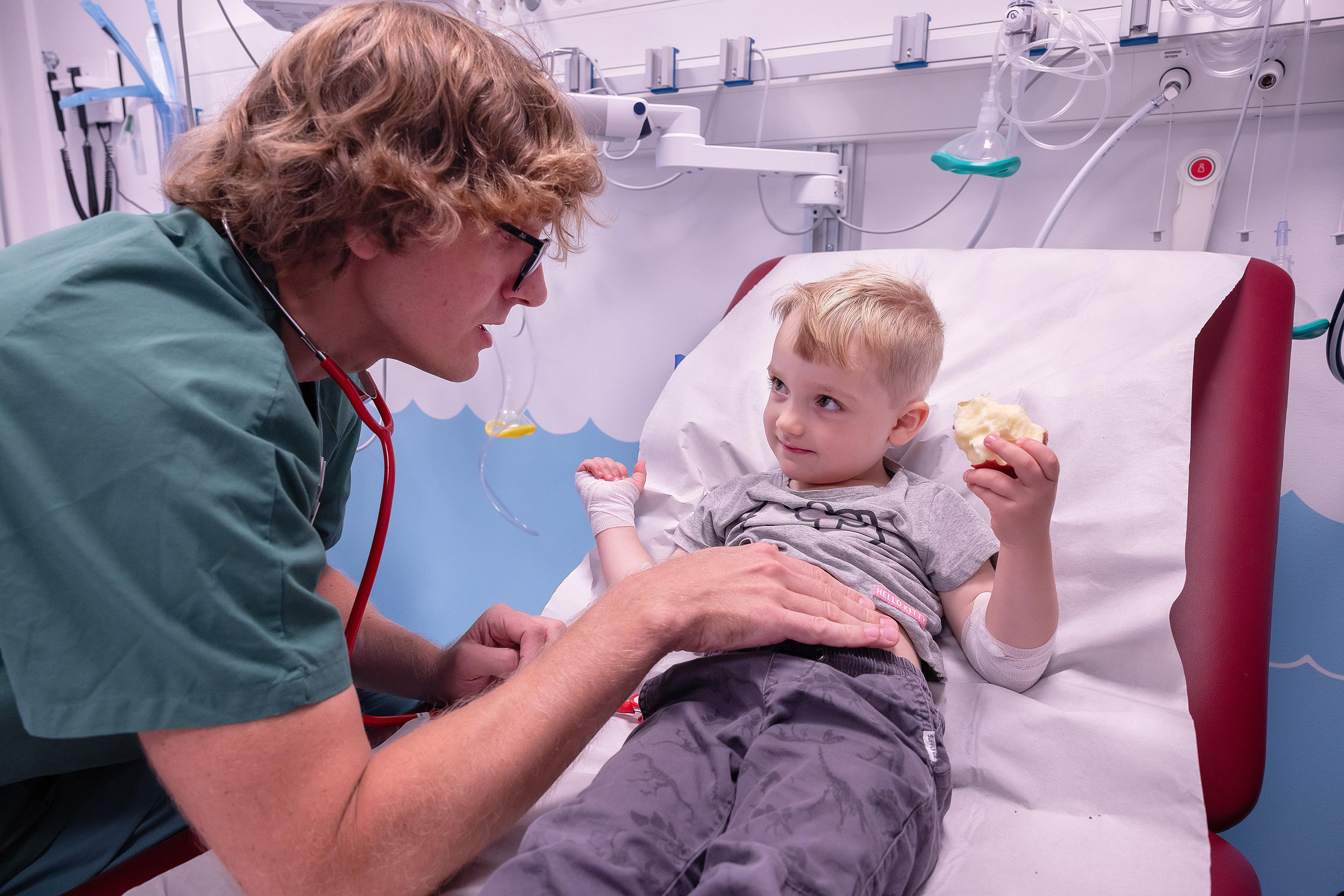 A doctor comforting a child.