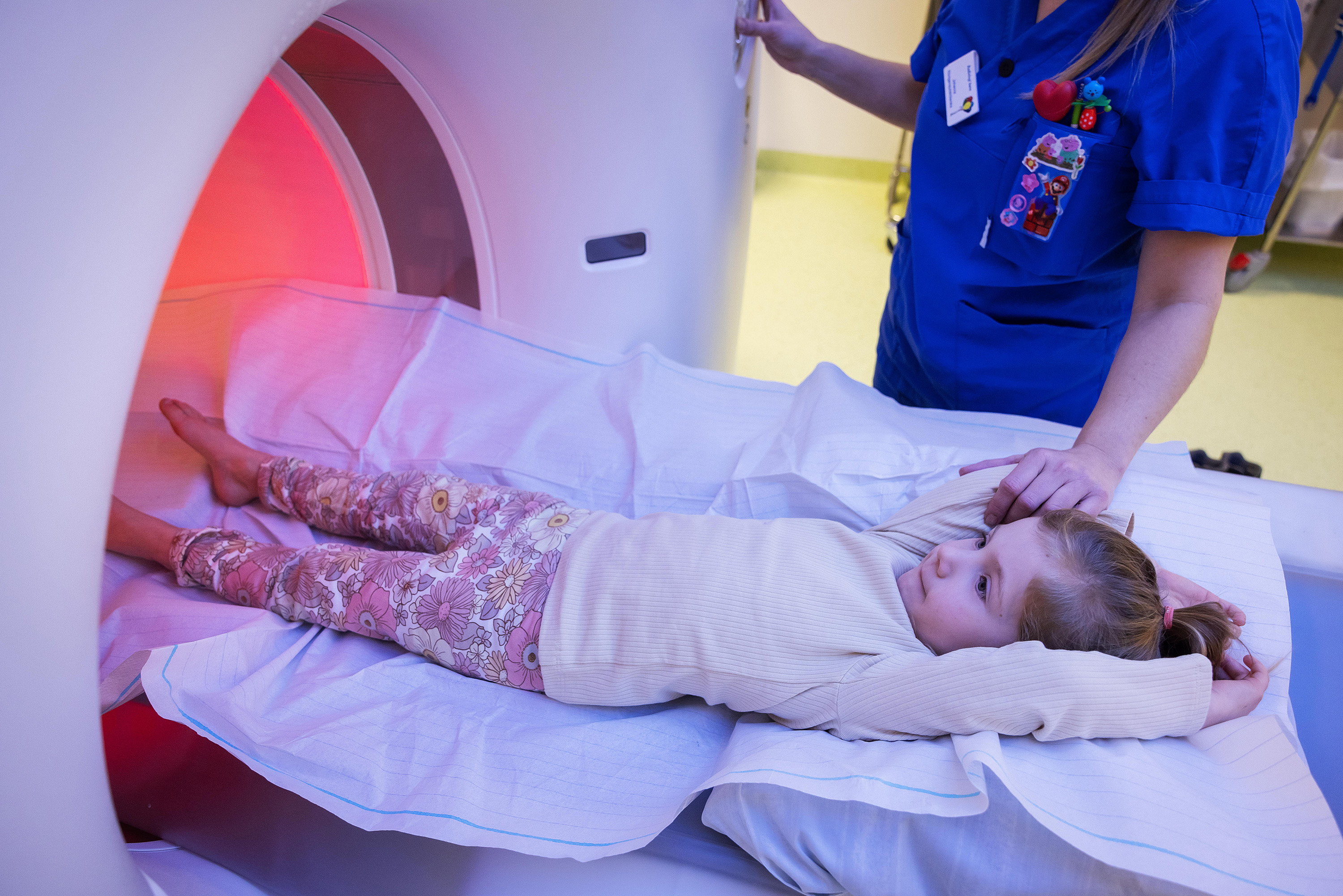 A child being entered into an MRI machine.