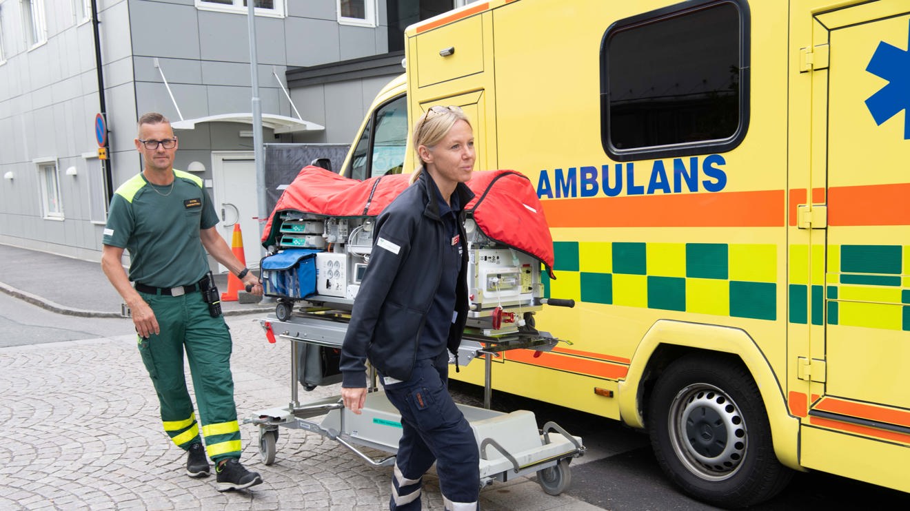 A neonatal child being transported to an ambulance.