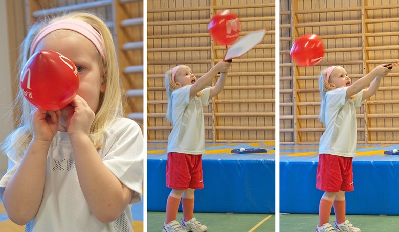 Ballongtennis. Ett barn blåser upp en röd ballong