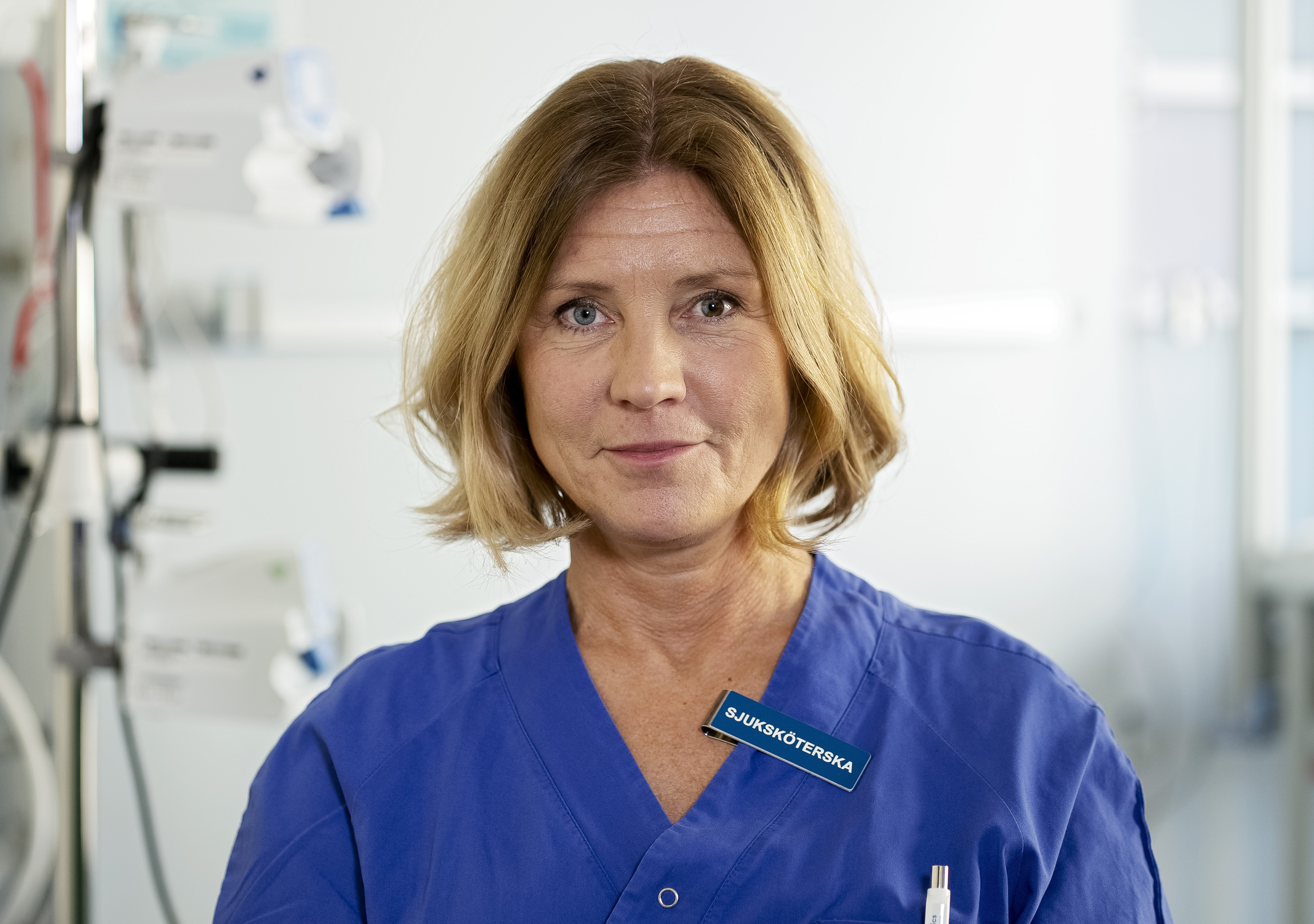 Female medical professional in blue clothes 