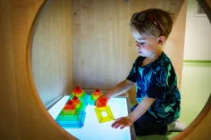 A child playing with cubes.