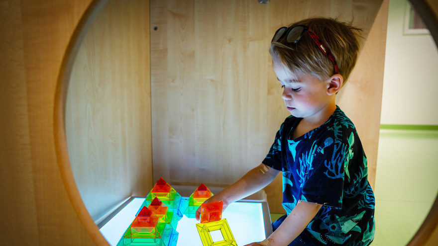 A child playing with cubes.