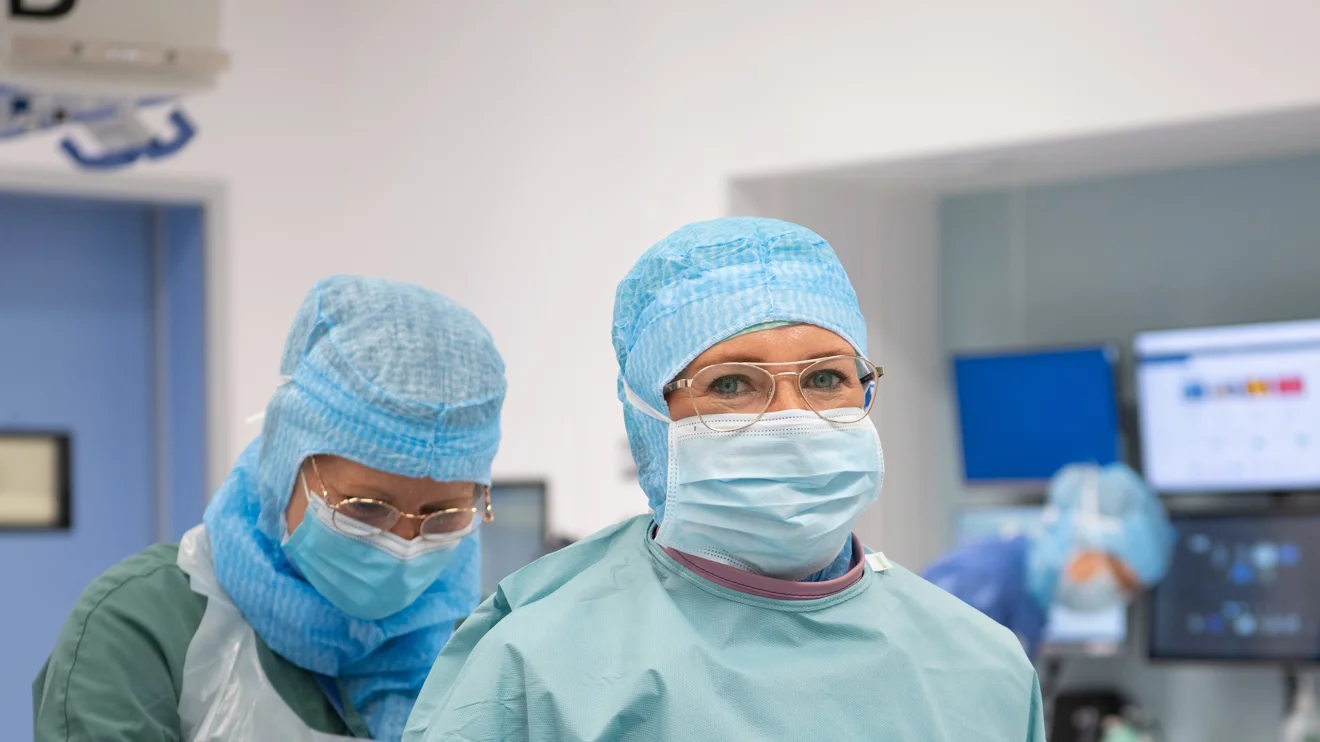 Two surgeons preparing for surgery.