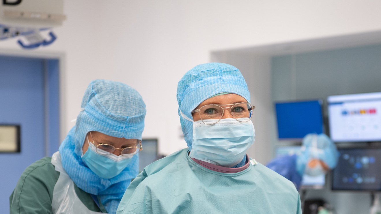 Two surgeons preparing for surgery.