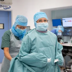 Two surgeons preparing for surgery.