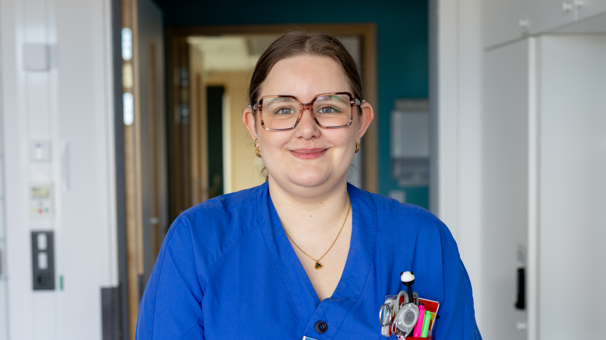 Female medical professional in blue clothes