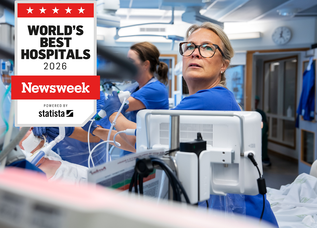 Newsweek logo and a nurse looking up at a screen.